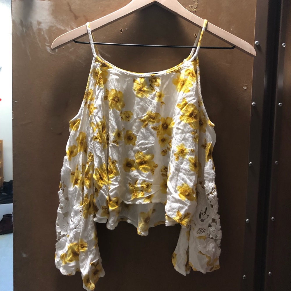 Flowy white shoulder cut out flower top